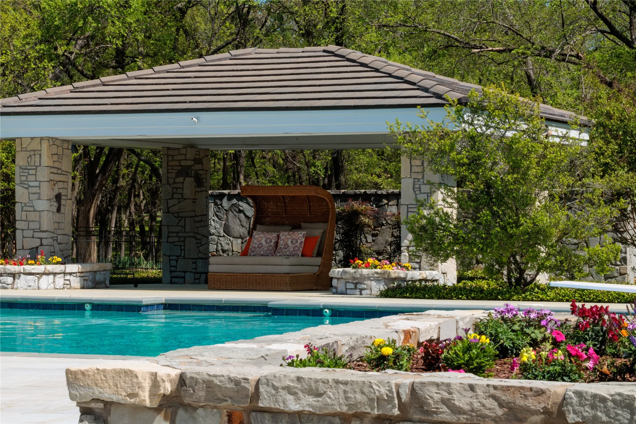 Cabana overlooking huge swimming pool.