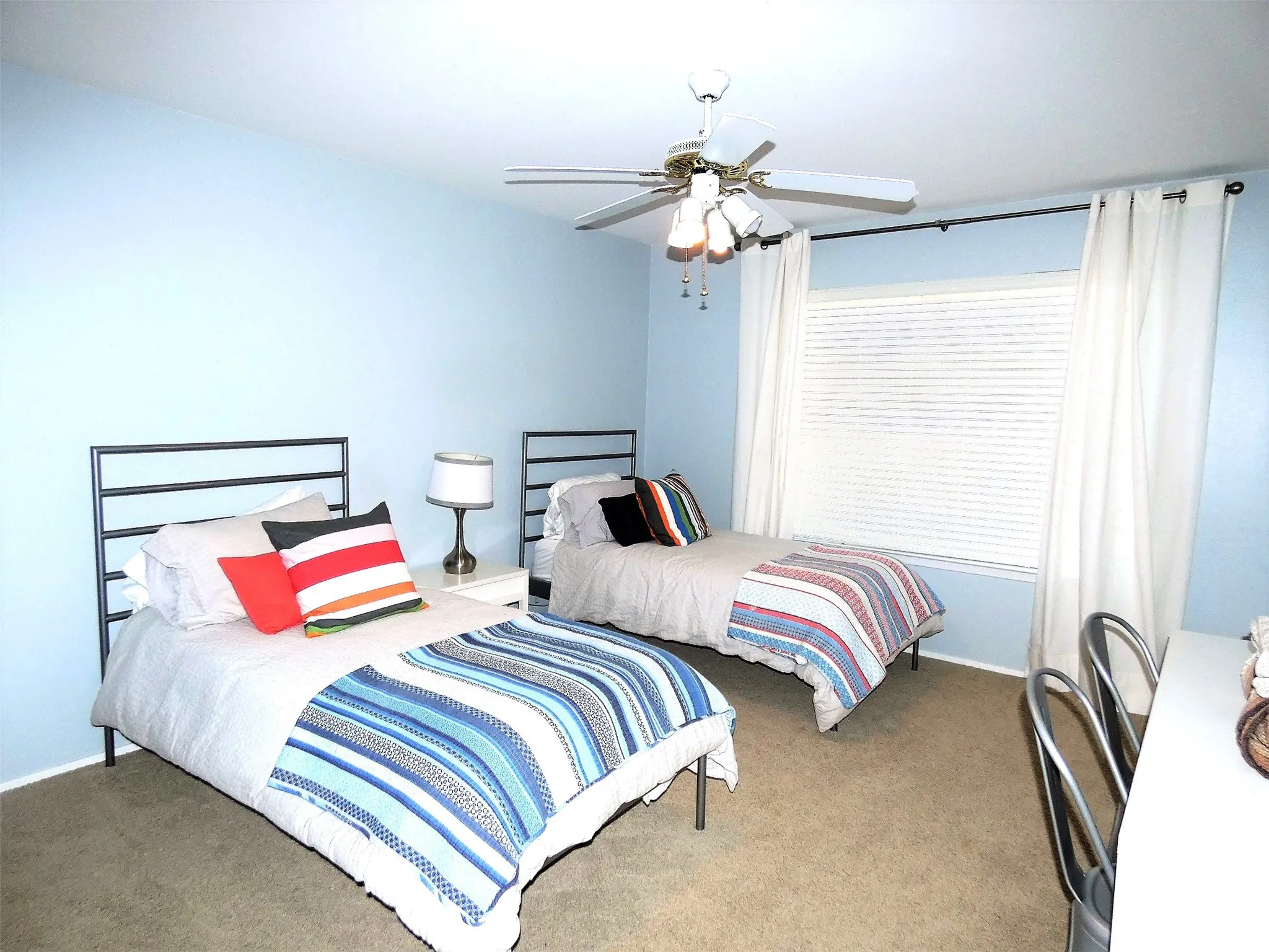 The second bedroom has two twin beds and private bath.