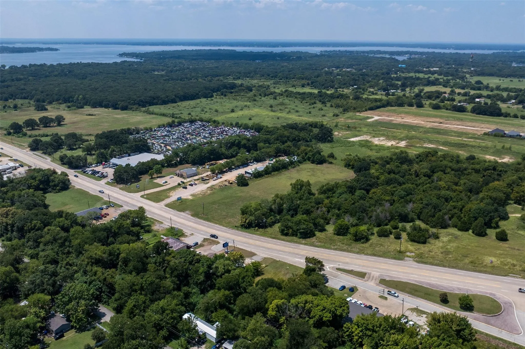 Expansive aerial perspective showcasing a significant body of water in the background