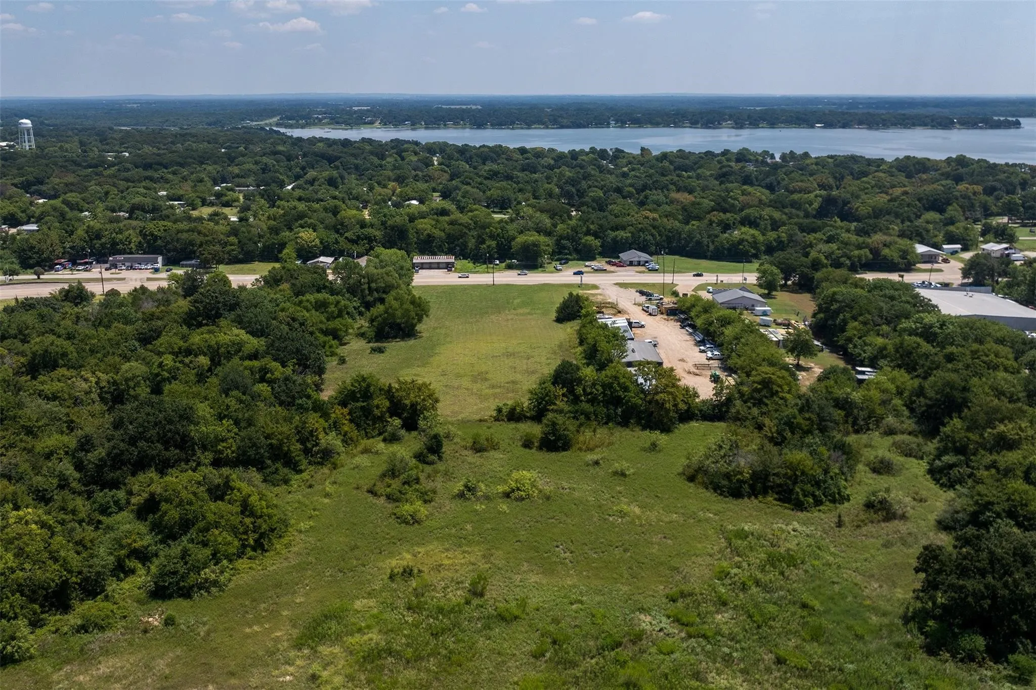 Expansive undeveloped land featuring a combination of grassy areas and mature trees