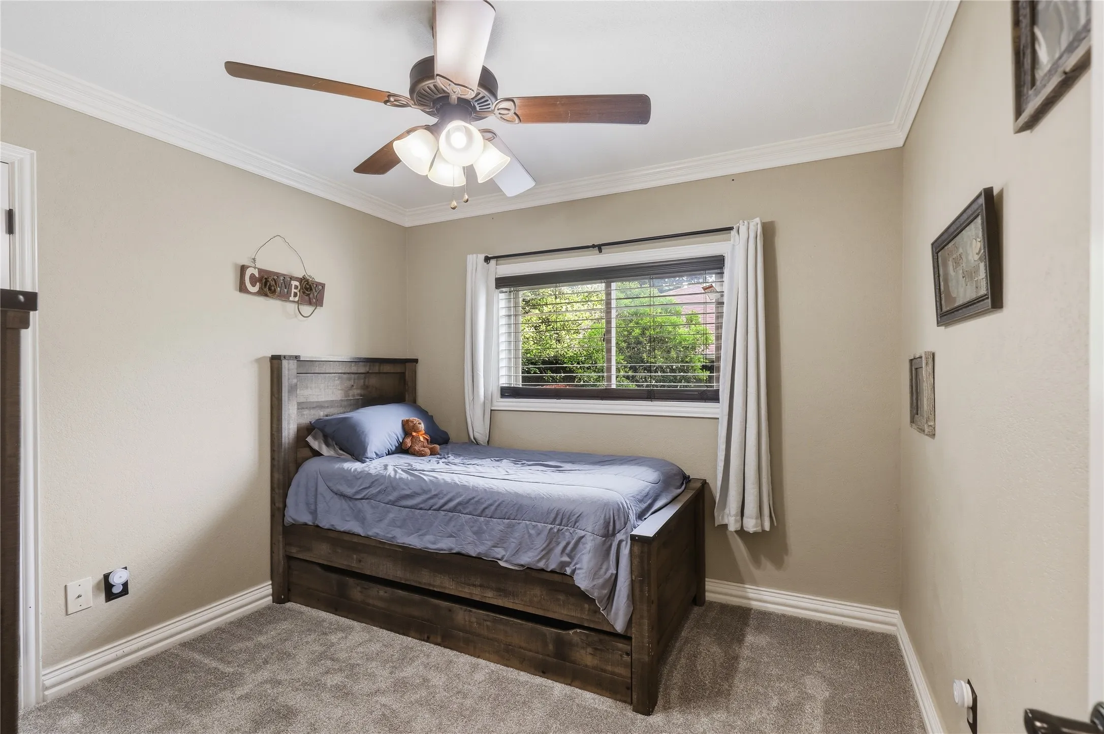 Neutral wall tones with crisp white crown molding and baseboards
