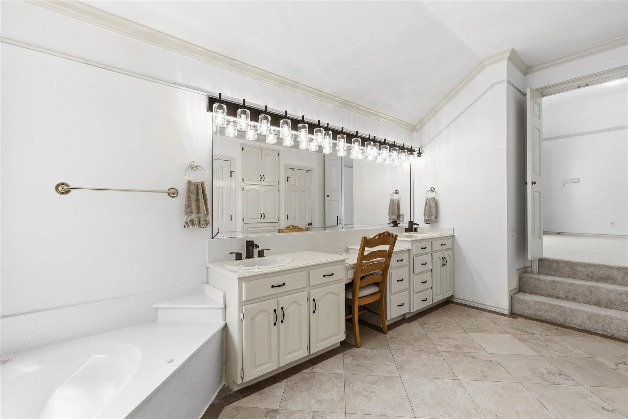 2 spacious walk-in closets which join, adjacent to the dual sinks.