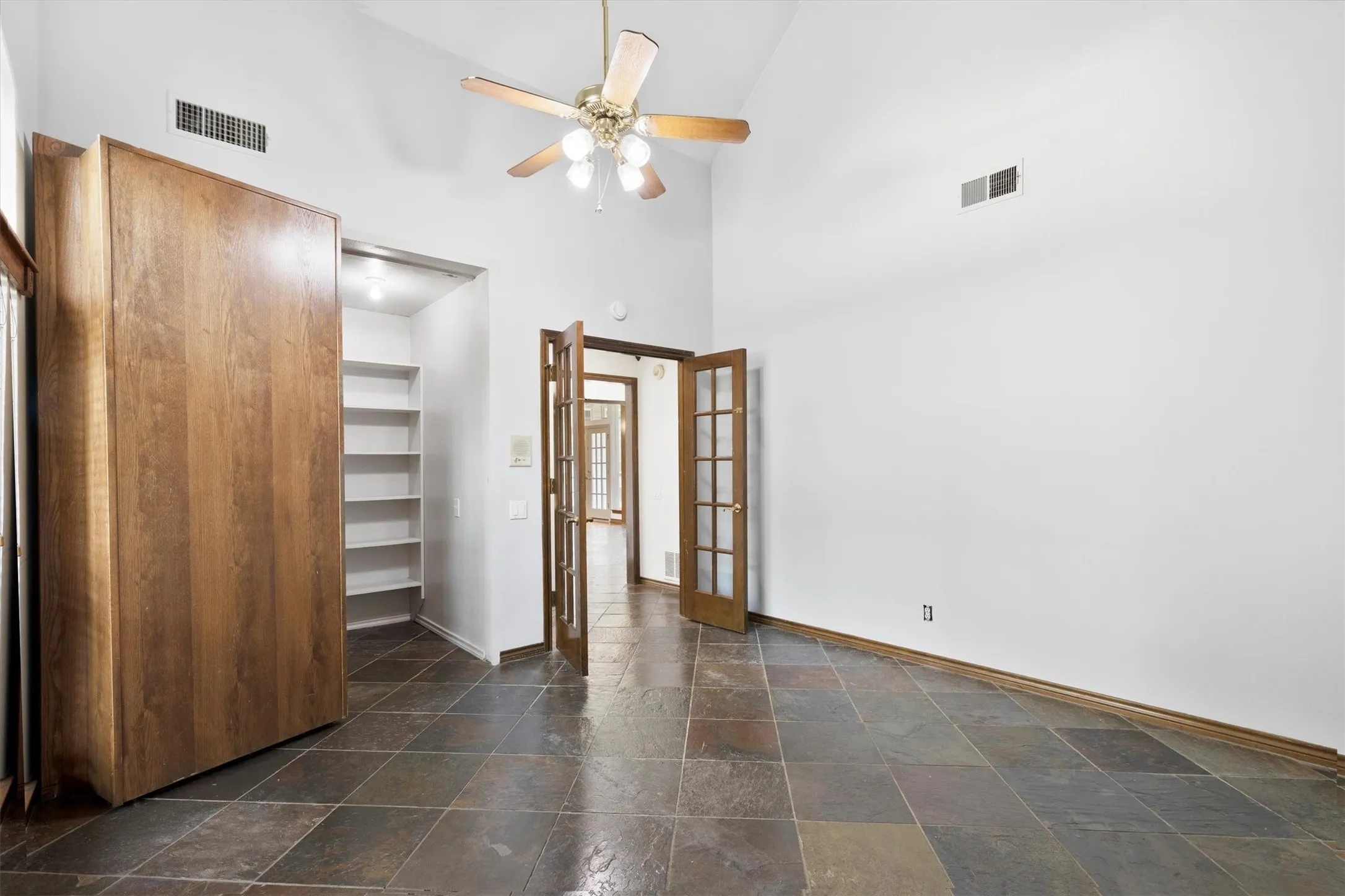 Flex bedroom with built-ins—ideal as office, guest room, or hobby space.