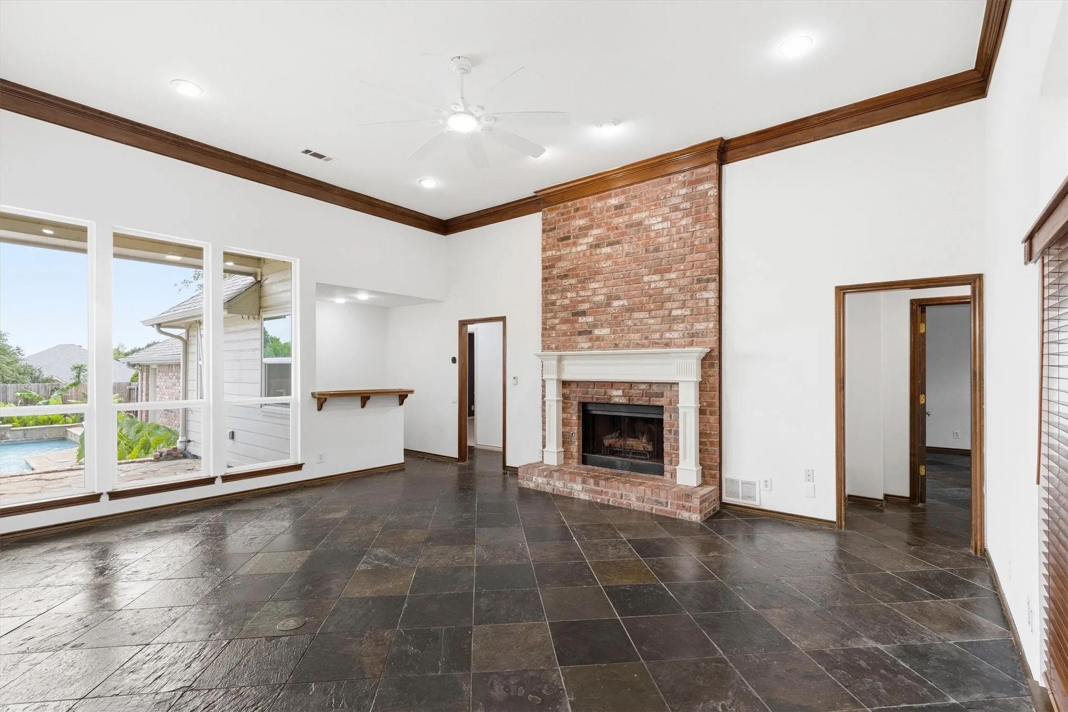 Family room opening toward the backyard and pool area.
