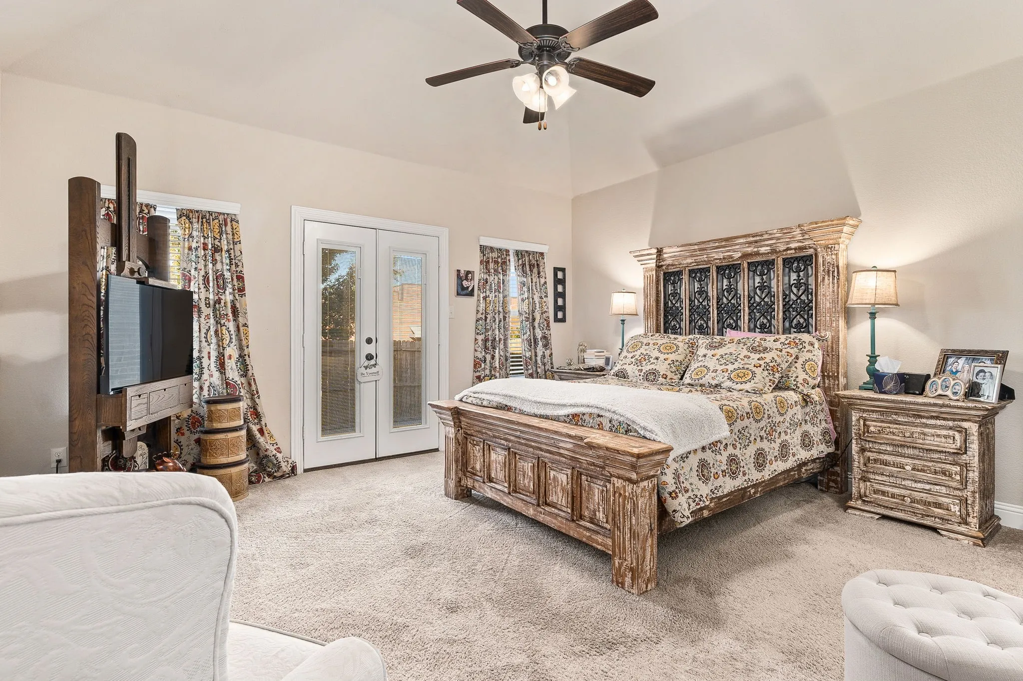 Carpeted bedroom with access to exterior, french doors, ceiling fan, and vaulted ceiling