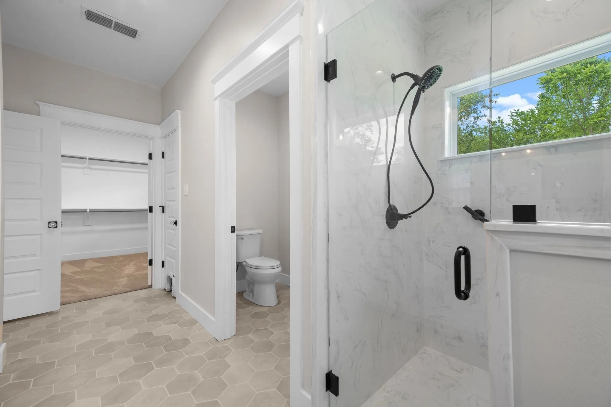 Walk-in shower and private bath layout designed for comfort and accessibility.