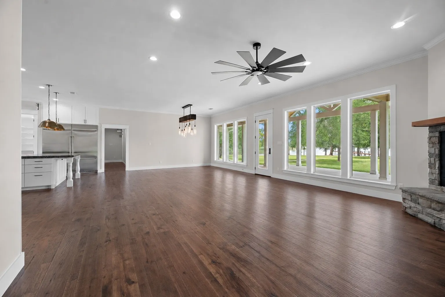 Open-concept living area with engineered hardwood floors and bright natural light.