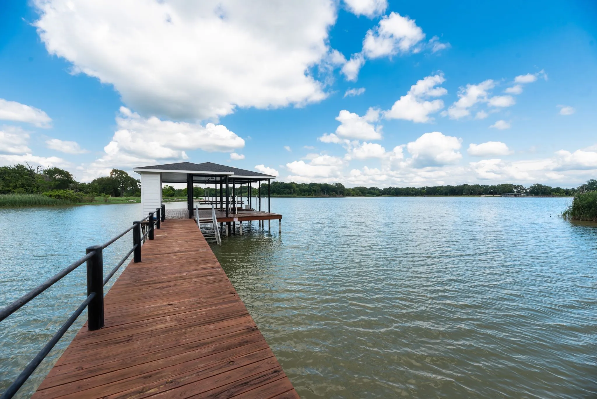 Covered boathouse and peaceful lake views on Richland Chambers Lake.