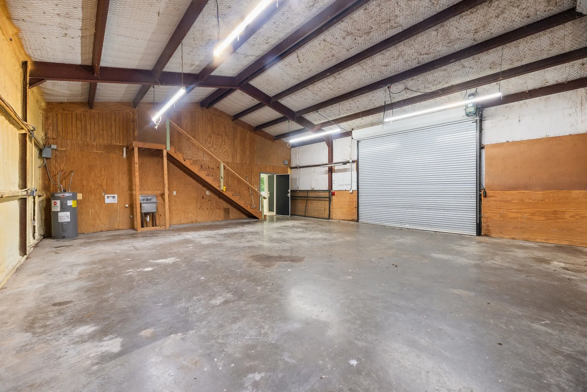 Workshop and covered equipment area add flexibility for lake and country living.