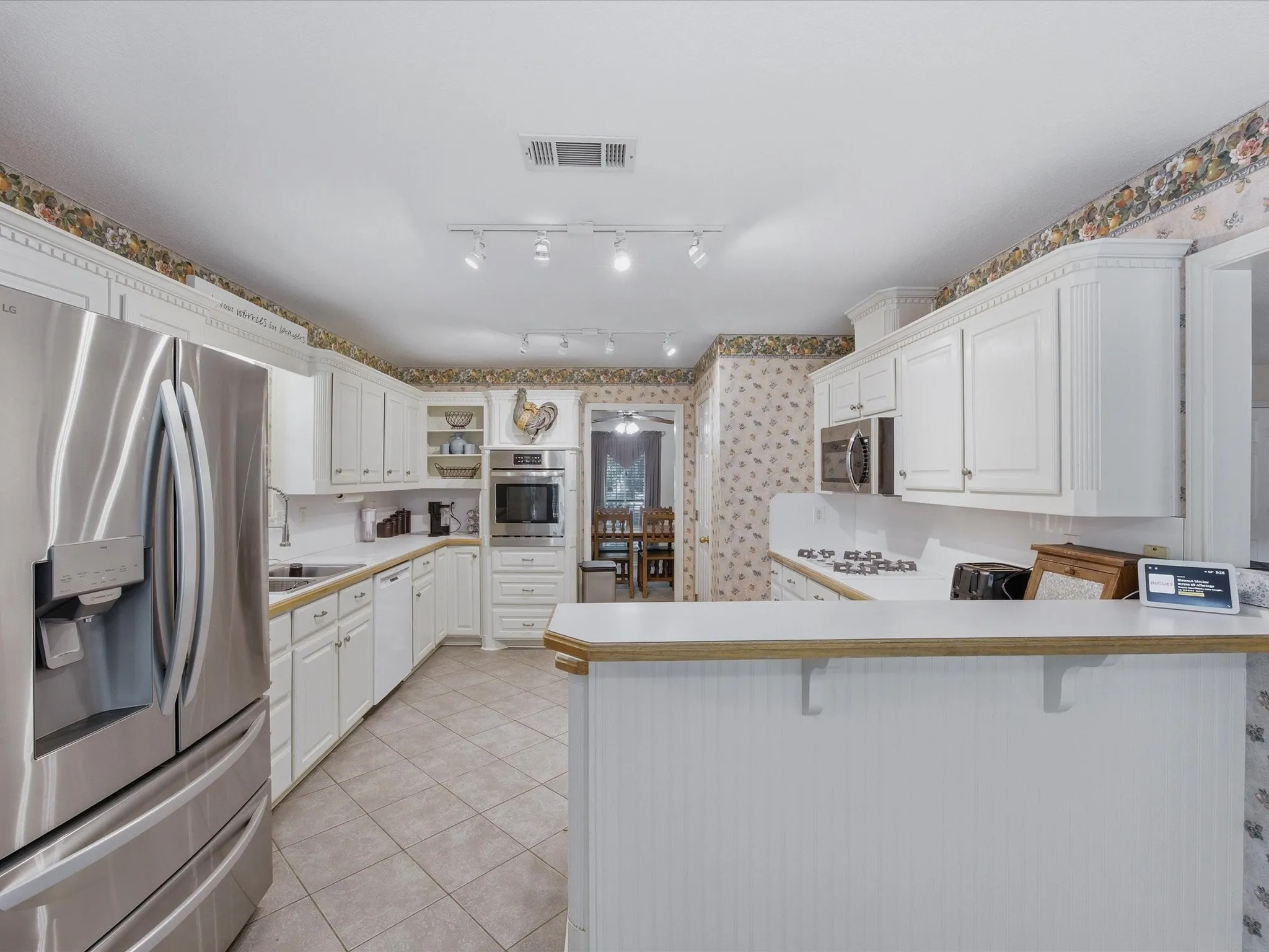 Matching wall oven, and microwave in kitchen with gas cooktop