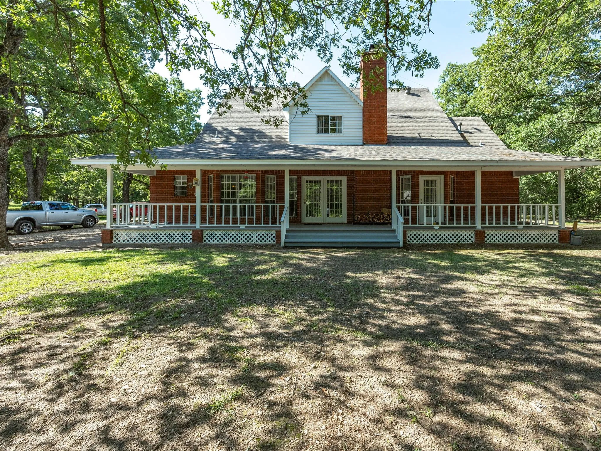 Shows beautiful covered wrapped porch