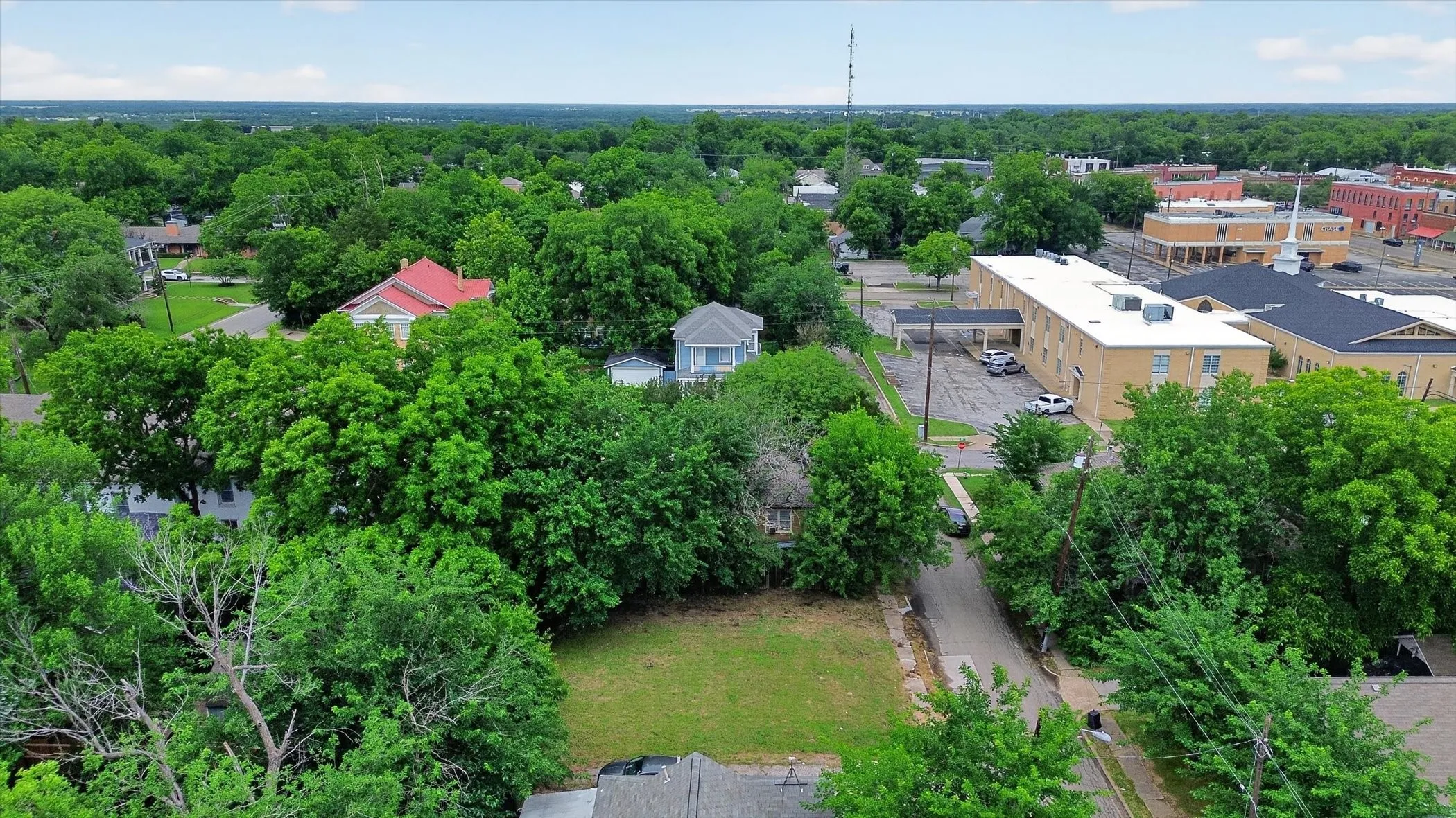Expansive lot featuring a grass lawn