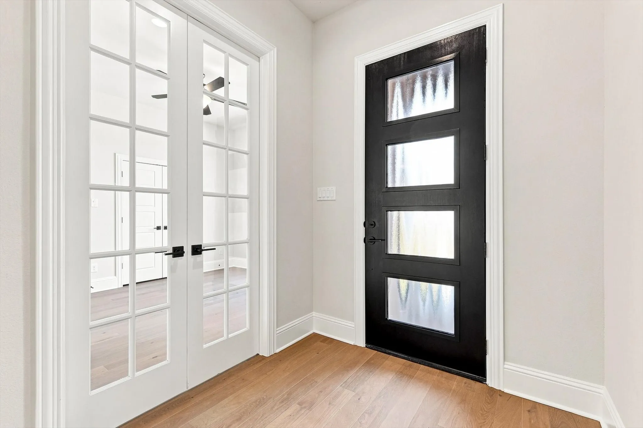 Entryway and dedicated office with closet.