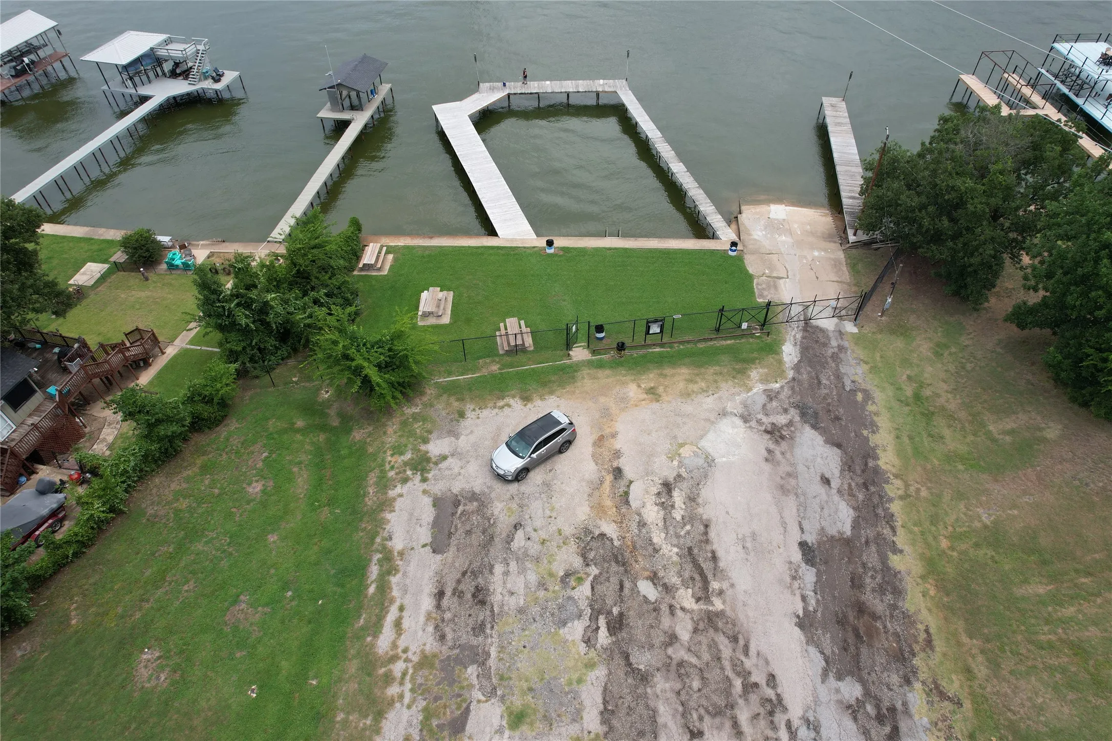 Cedar Crest Shores waterfront neighborhood park with picnic area, lake access, large pier, and boat ramp