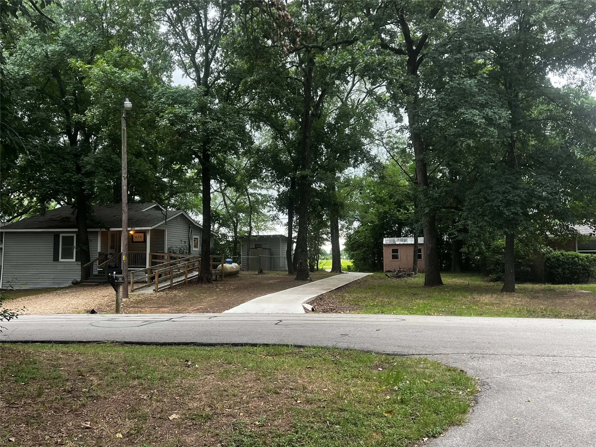 Concrete walking path in Cedar Crest Shores, at the end of Hilltop Drive providing neighborhood access to The Eight at Tool Park