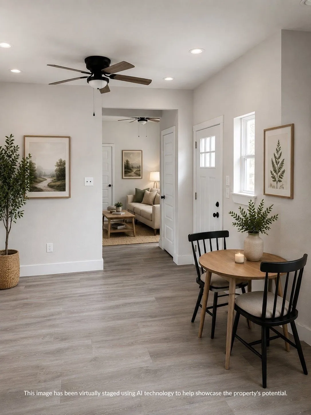 Open-concept living space featuring wood-finish flooring, recessed lighting, and a ceiling fan