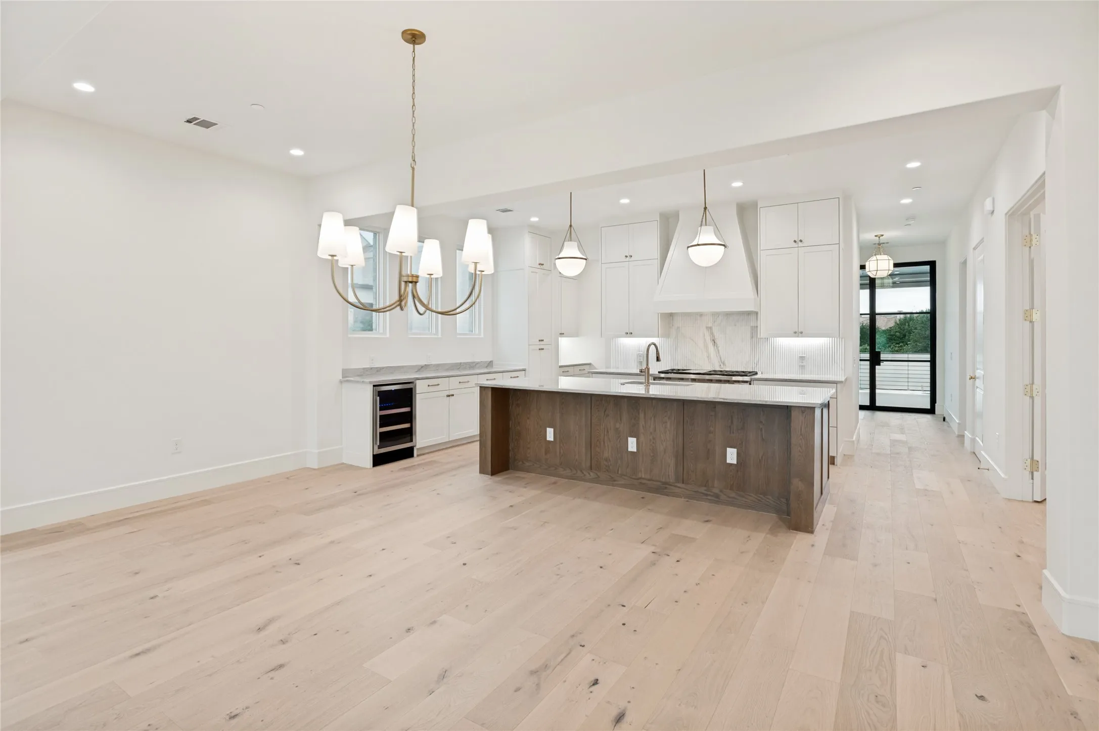 A grand open living space with an oversized island creates effortless flow for entertaining