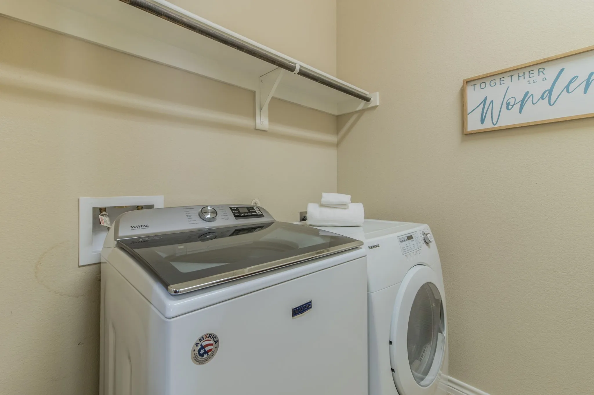 Laundry room is plumbed with water and drain for a future sink