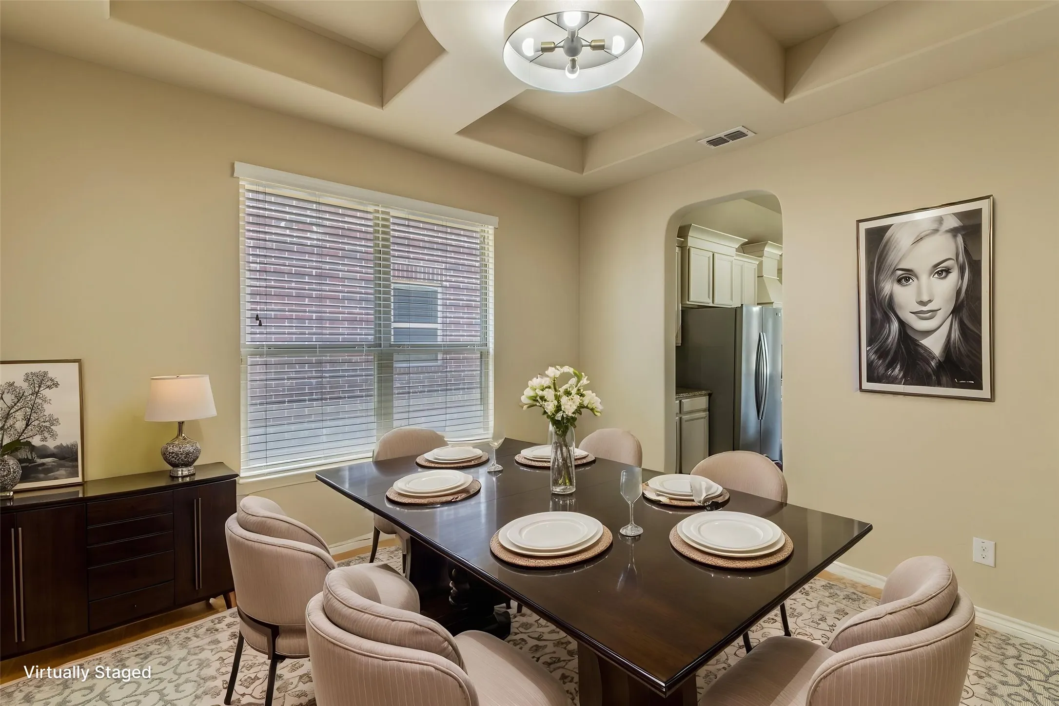 Formal dinning room with architectural coffered ceiling - virtually staged