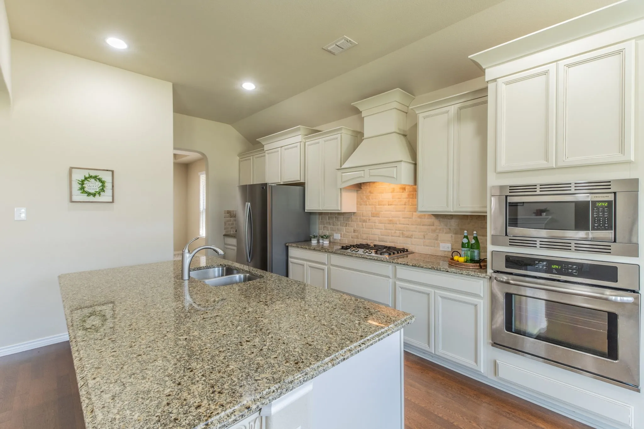 Kitchen island with sink, dishwasher and room for 4 bar stools
