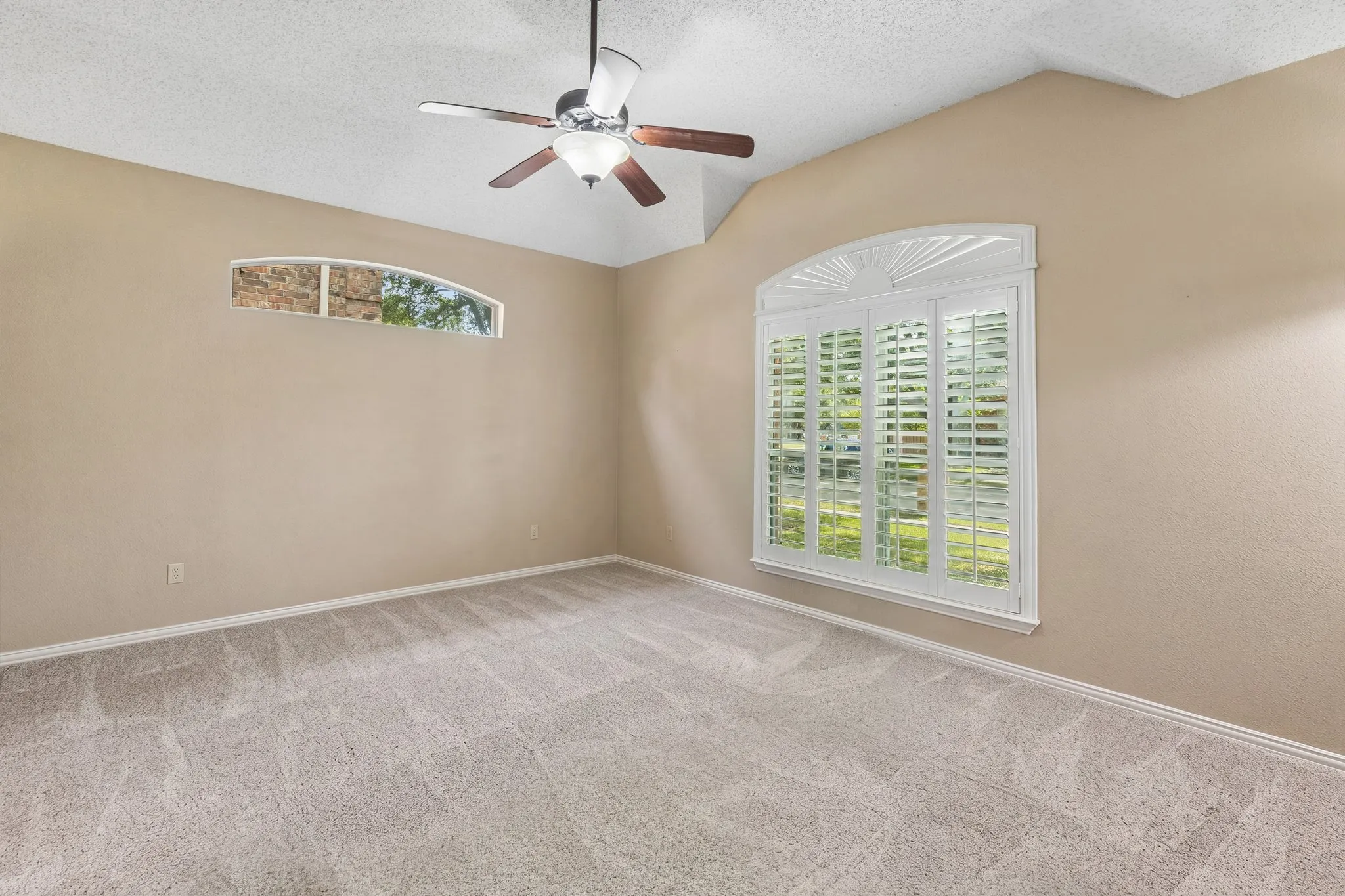 Features of the room include ceiling fan, high ceiling and carpet. All carpet was replaced in 2023.