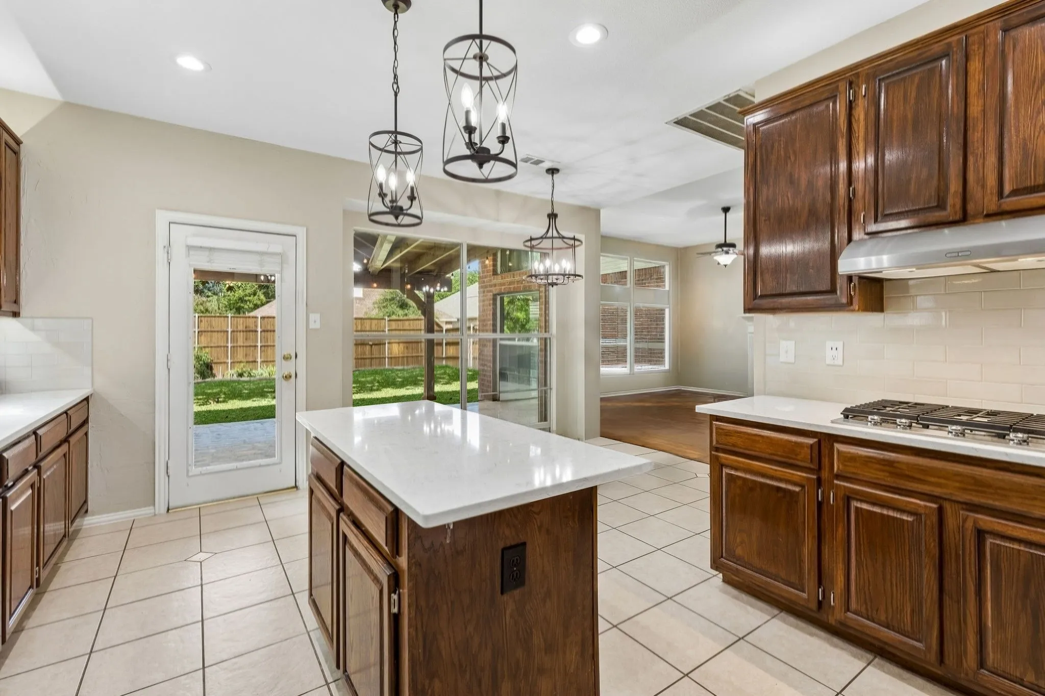 Find fantastic storage in the kitchen including 42 in cabinets, long counters for food prep, a pantry and easy access to the outside living space. Another feature is under and over cabinet lighting!