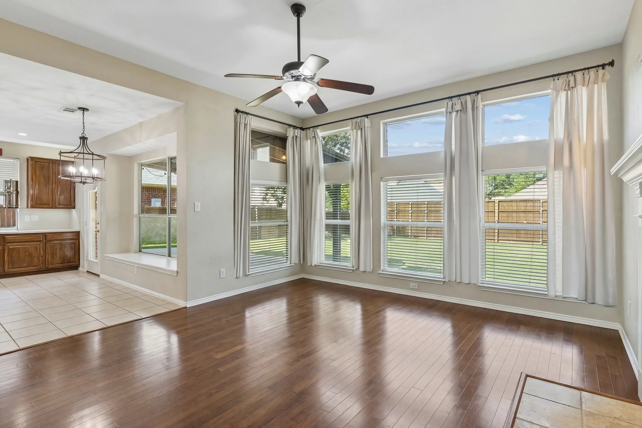 The family room is the heart of the home. Open to the nook and kitchen, this is a wonderful space for relaxing with family and friends or cozy nights in. Enjoy the wall of windows giving views of the back yard and lovely light!