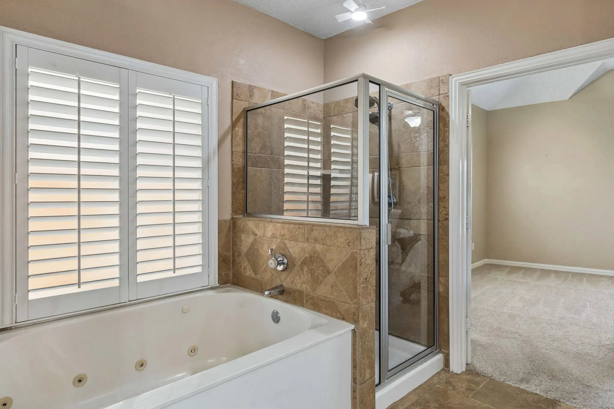 Separate shower and jetted tub.
