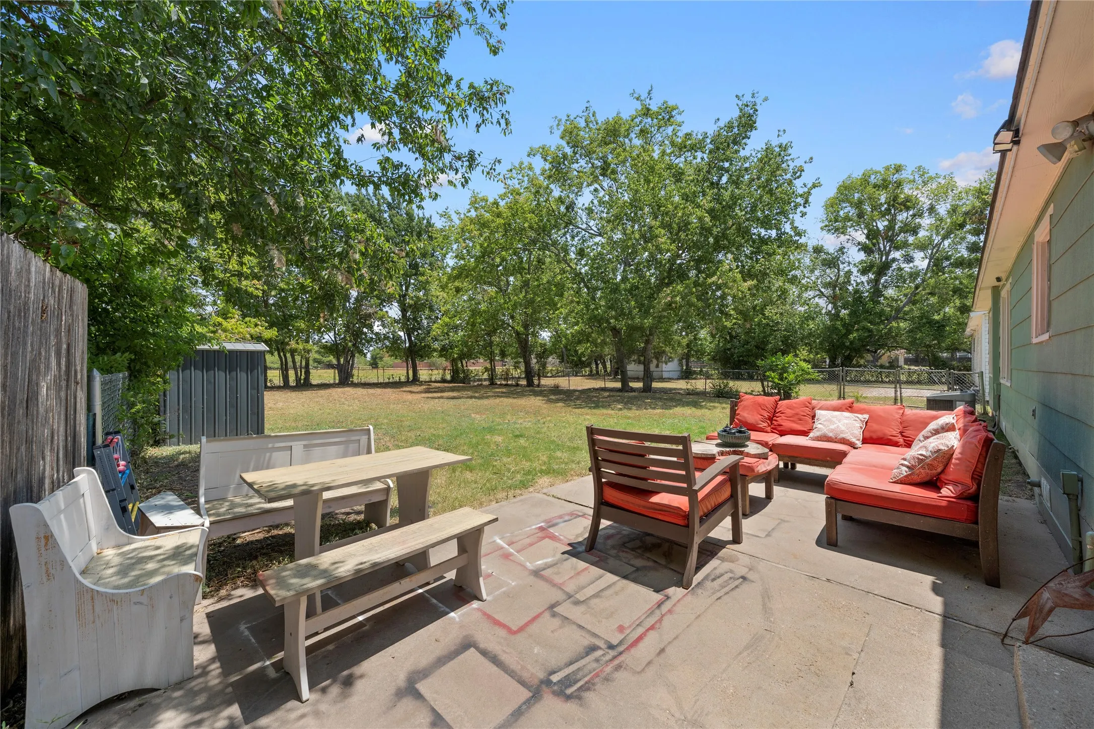 Spacious concrete patio offering extensive outdoor living space