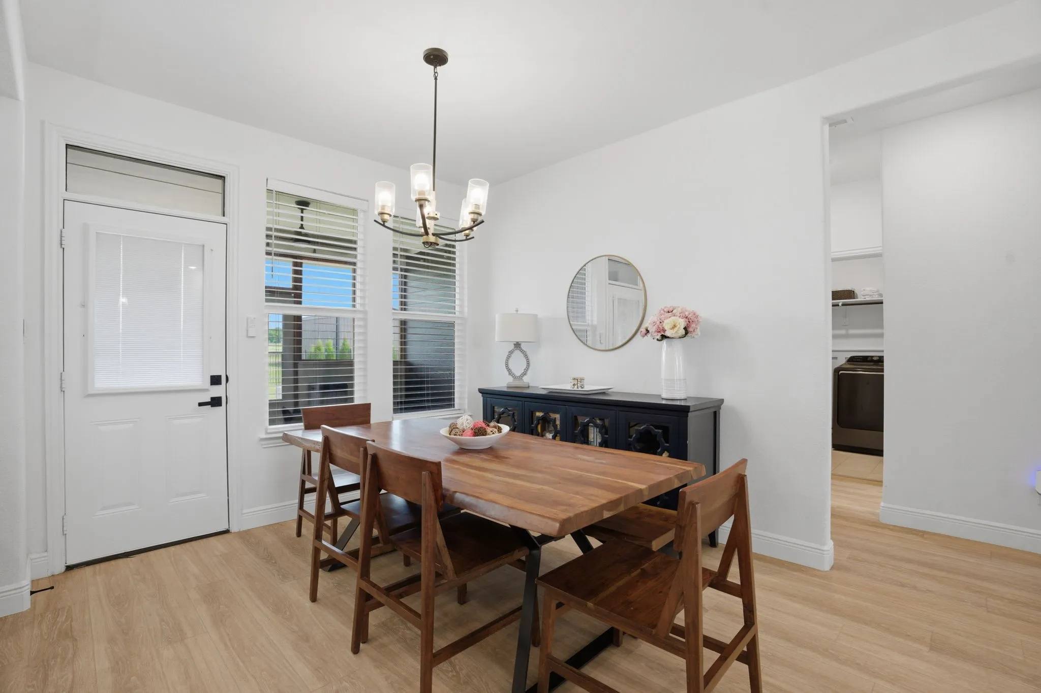 Dining area can accommodate any table shape. Door leads to the screened porch & backyard.