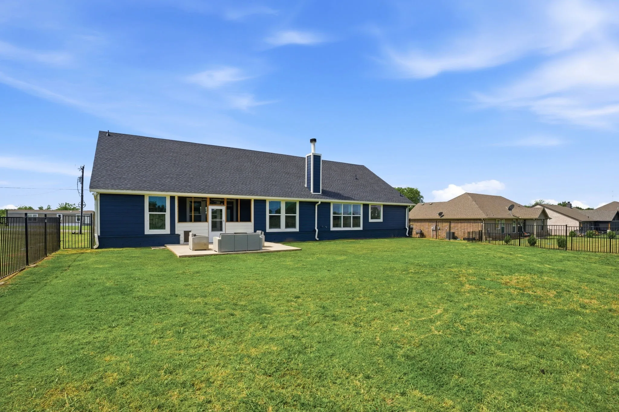 Unlimited possibilities in your backyard---add a future pool, workshop or outbuilding, guest house.  In addition to the patio, the sellers enclosed the back porch for their pets. Makes an ideal sunroom too.