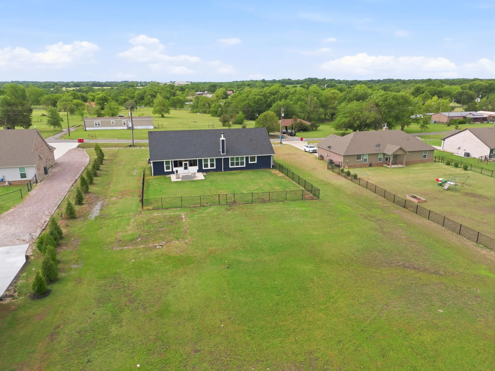 Another look at the expanse of this property, surrounded by a pretty skyline.