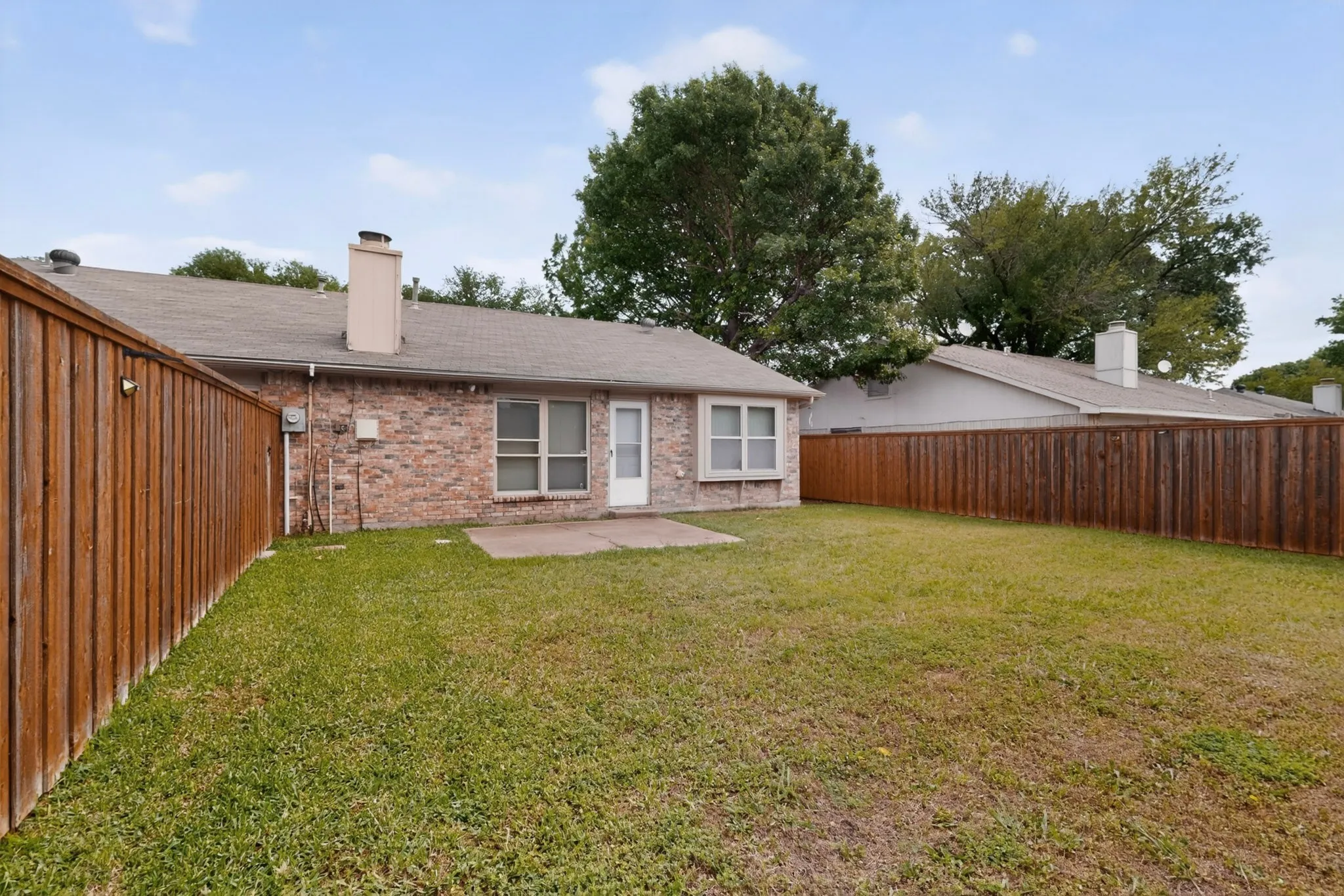 Large fenced back yard.
