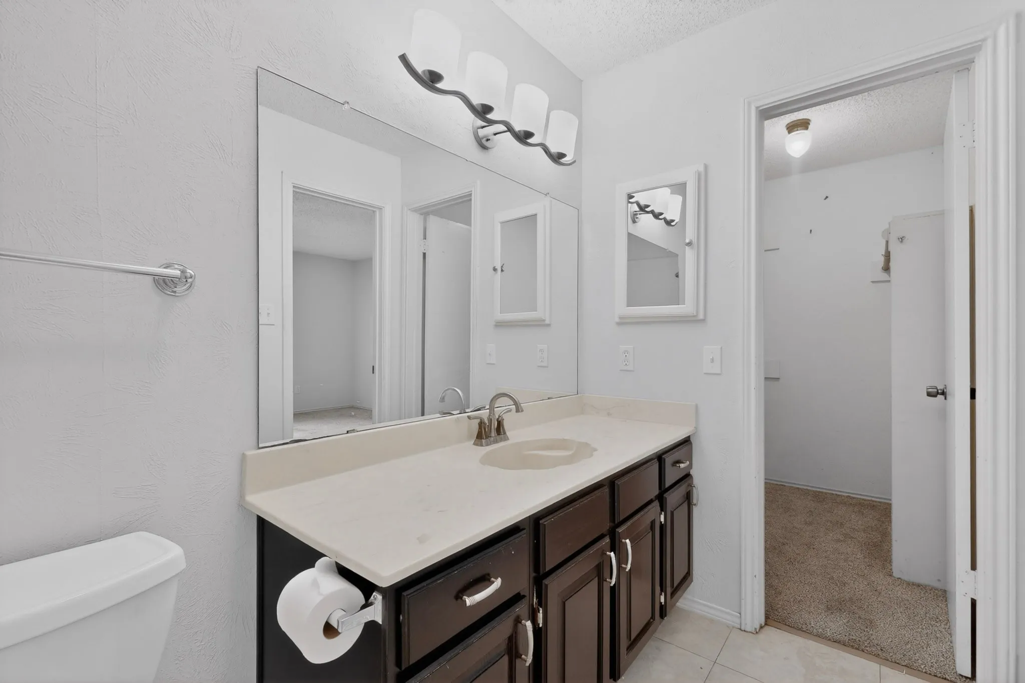 Primary bathroom with walk-in closet.