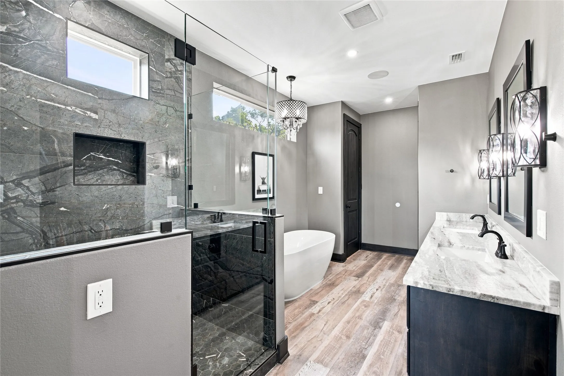 PRIMARY BATHROOM WITH CHANDELIER, FREE STANDING TUB AND WALK IN CLOSET