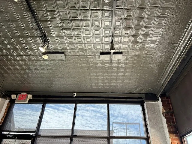 115 East Wall Street unit offers pressed tin ceiling with track lighting fixtures