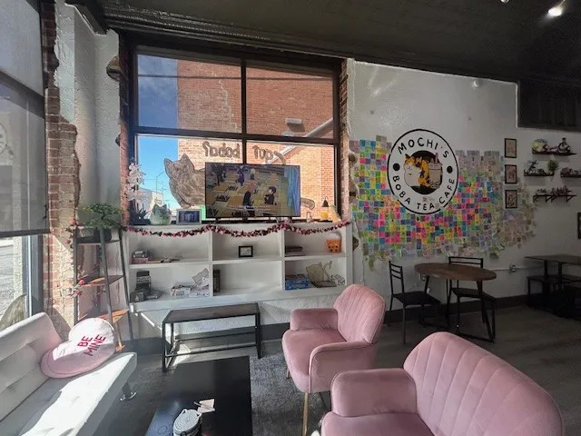 115 E Wall Street offers spacious interior featuring exposed brick accents and large picture windows