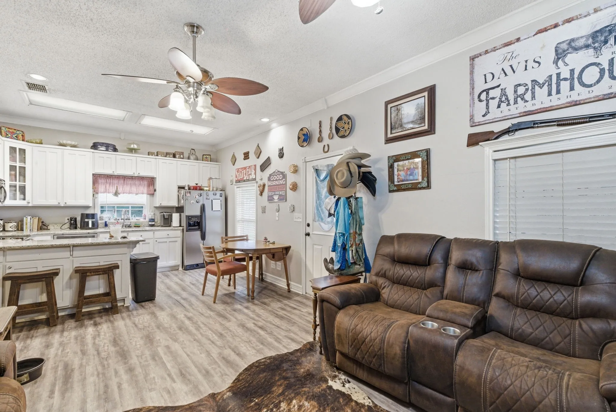 Open-concept living space featuring wood-finish flooring throughout