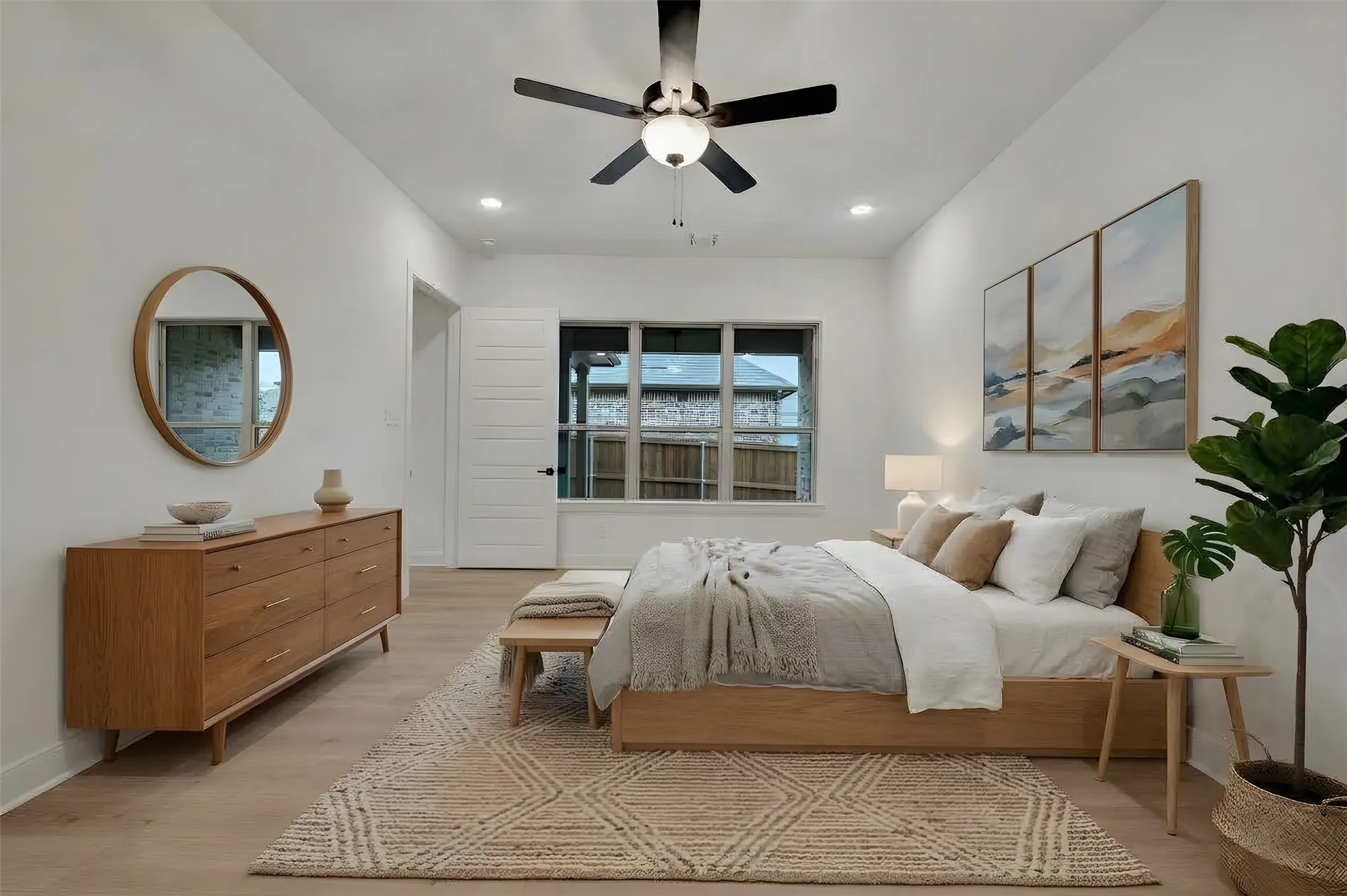 Recessed lighting, ceiling fan with light fixture, wood-finish flooring, white solid core door, multi-pane window