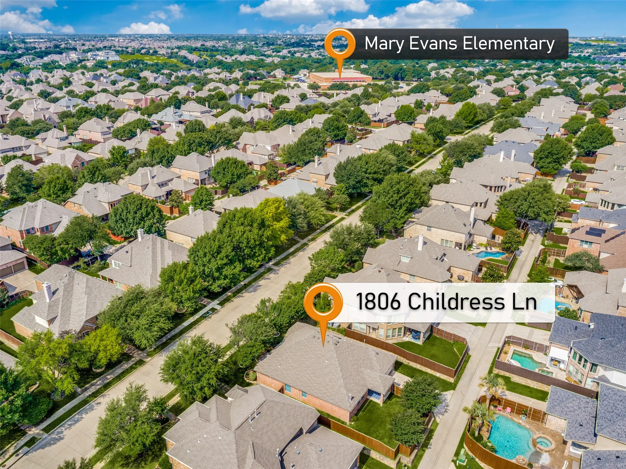 Aerial perspective showcasing the home nestled among much larger homes, and it's close proximity to the sought-after & top-rated Mary Evans Elementary!