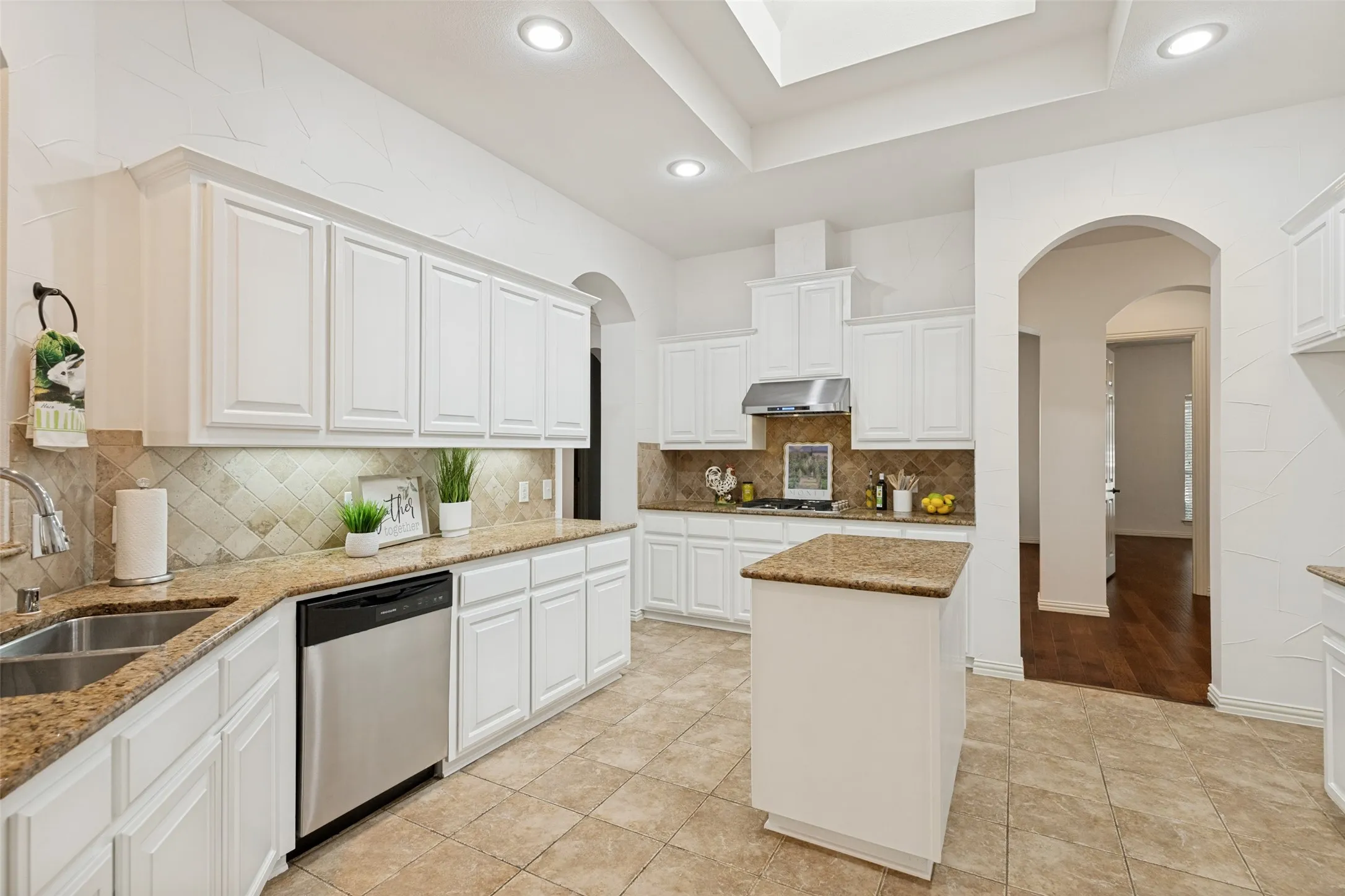 Light and bright Updated Single-story in a Prime Location in TWIN CREEKS! Close to top-rated Mary Evans Elementary school! Gourmet Kitchen featuring a gas cooktop with outside vent, abundant white cabinetry, light-toned Granite countertops, central island, stainless steel appliances, and skylight.
