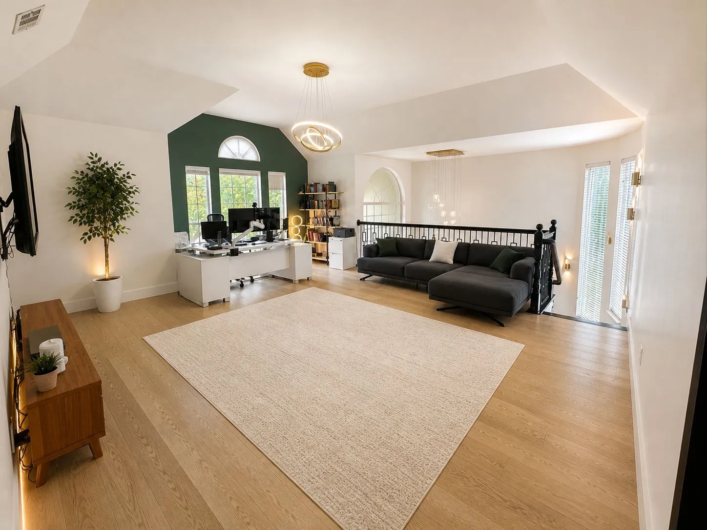 Bright open-concept space featuring light wood-finish flooring