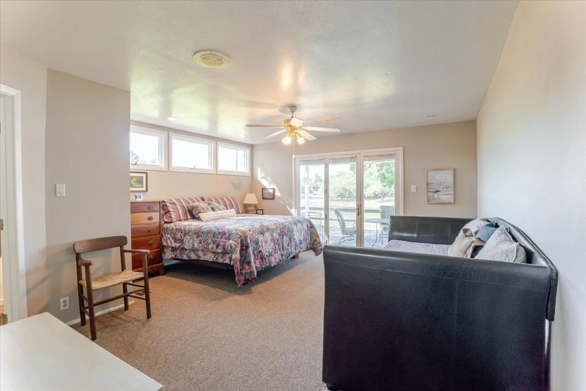 Large primary bedroom with direct access to the covered deck