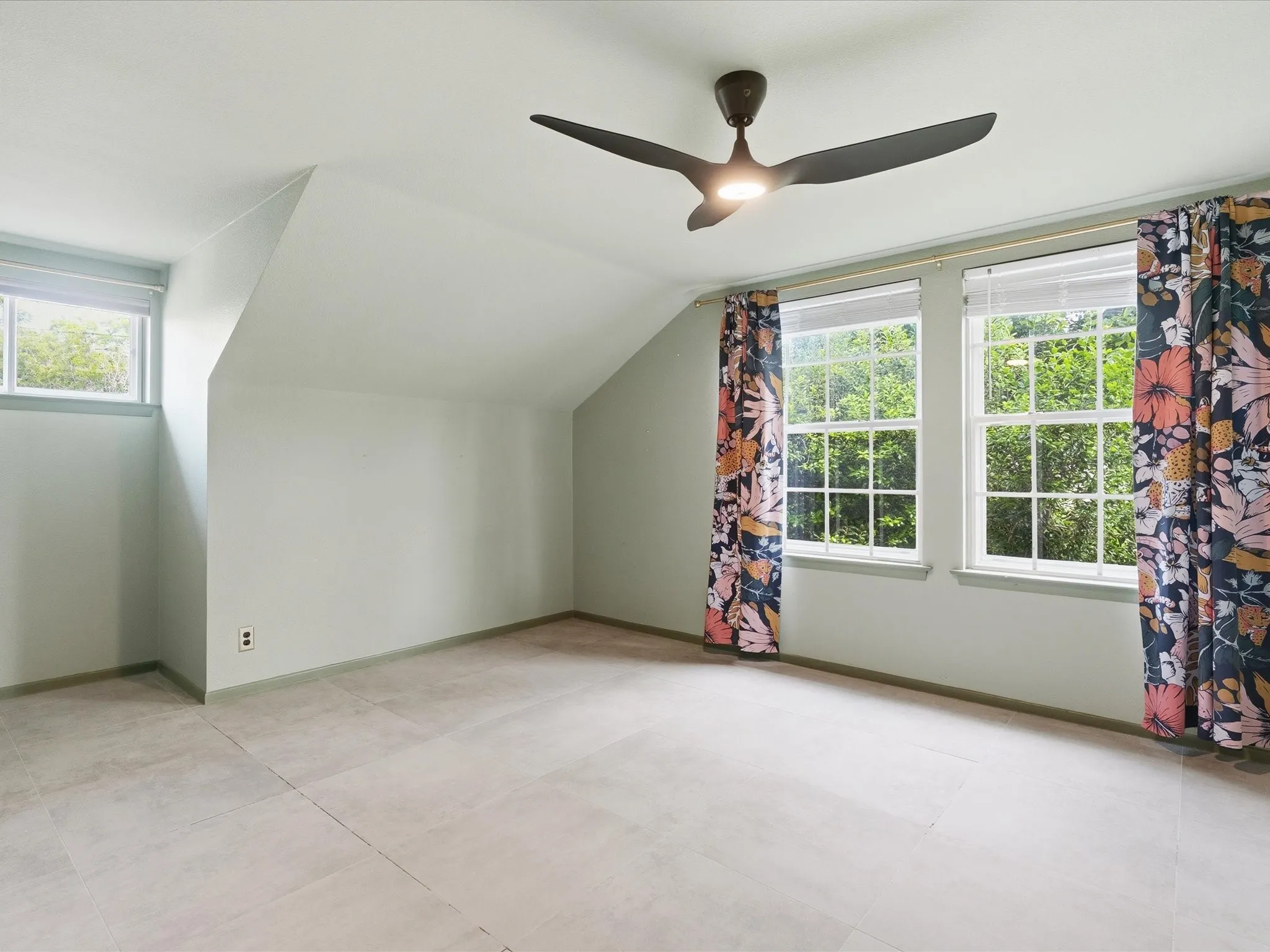 Bright room with three windows providing ample natural light