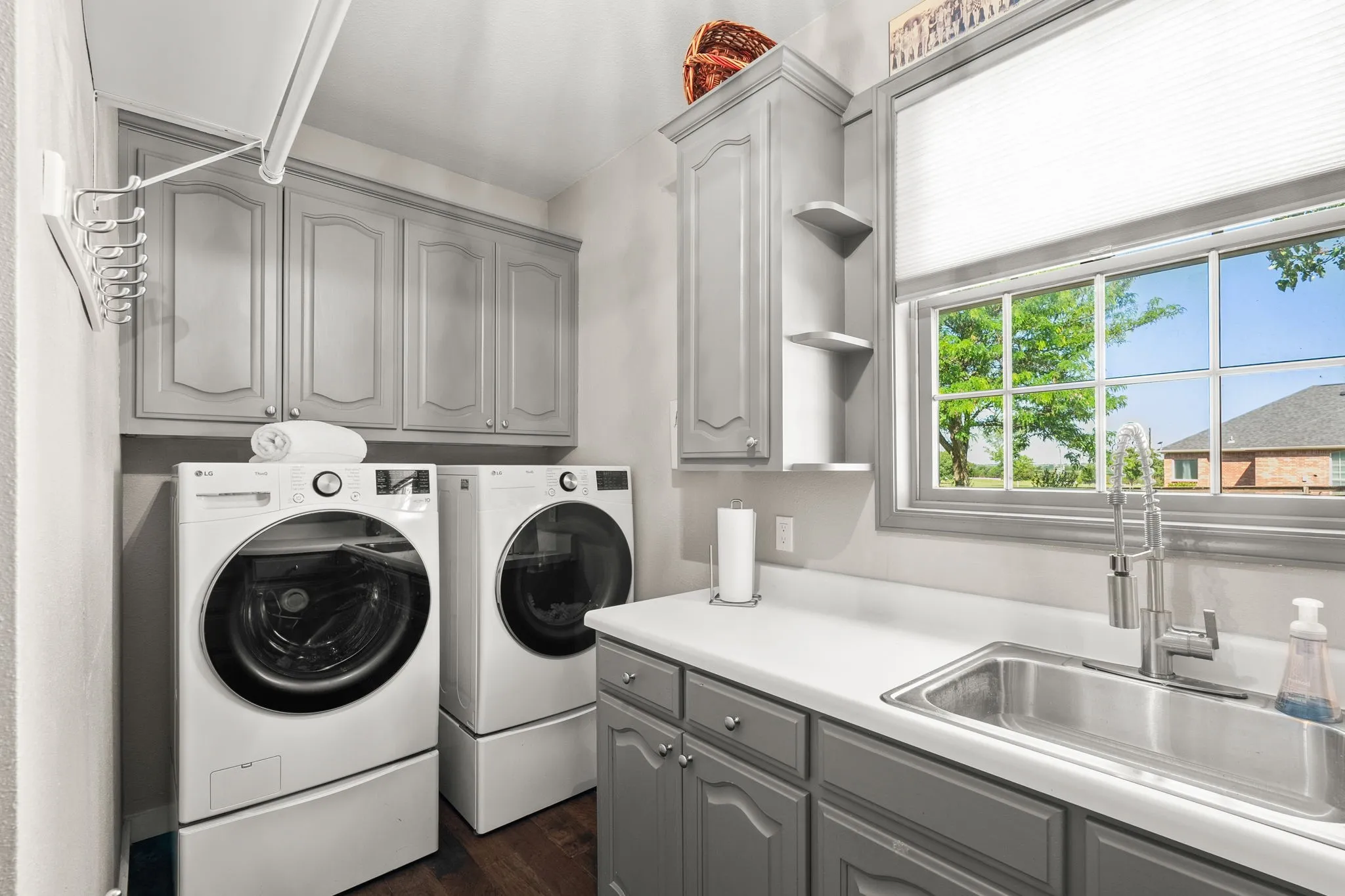 Large Laundry with built-ins, sink and drip-dry area.