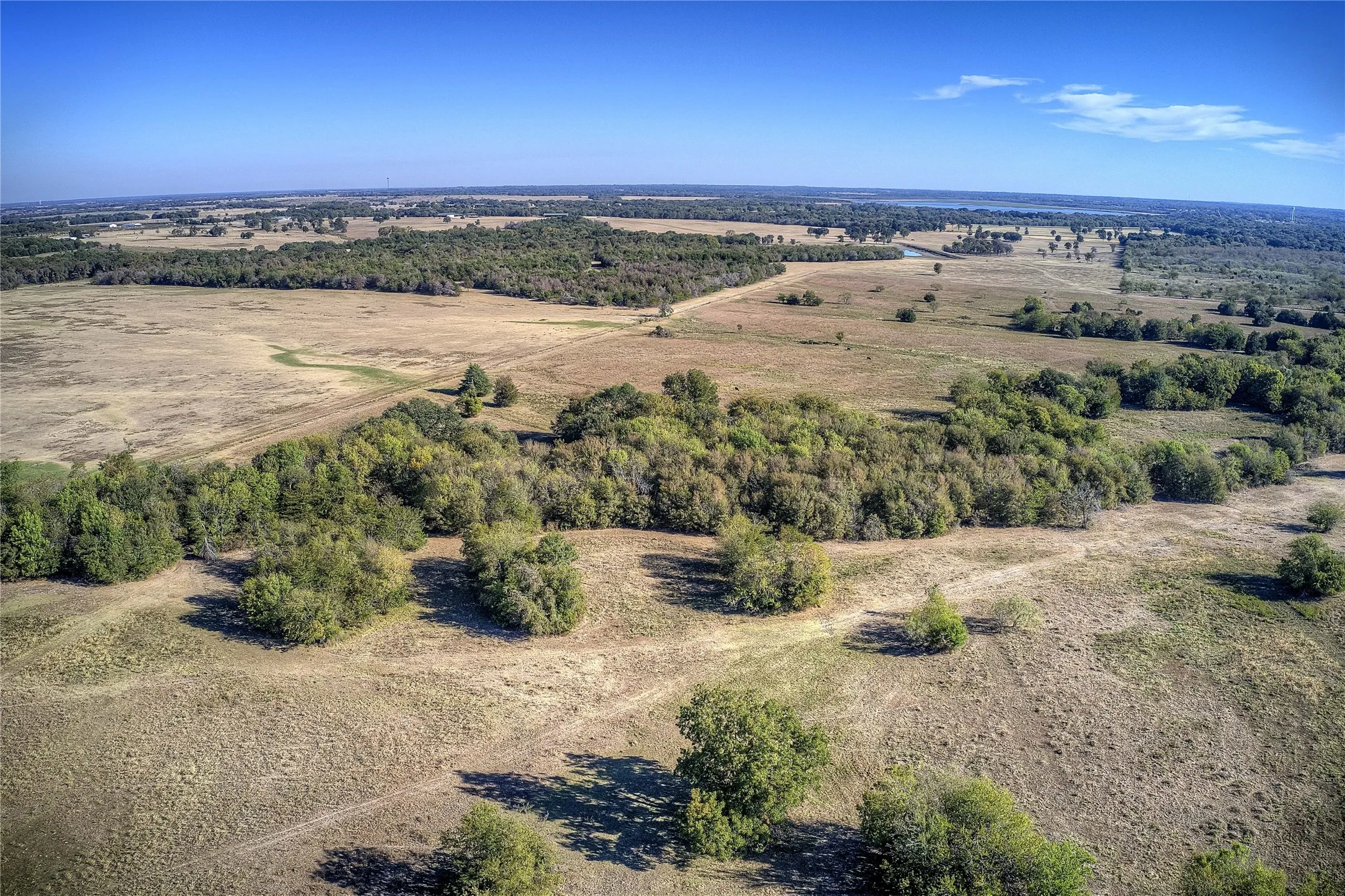 Birds eye view of property featuring a rural view