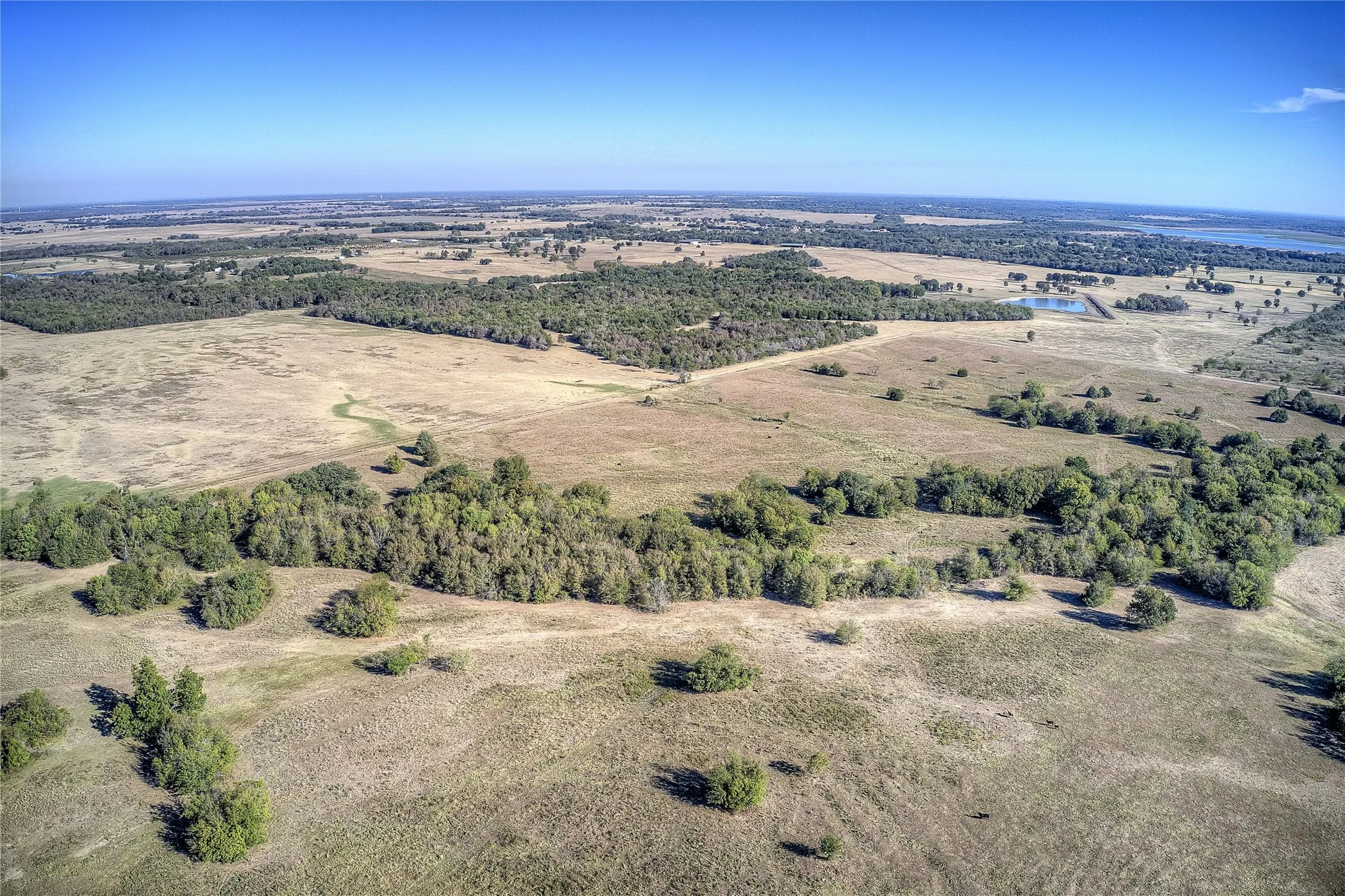 Birds eye view of property featuring a rural view