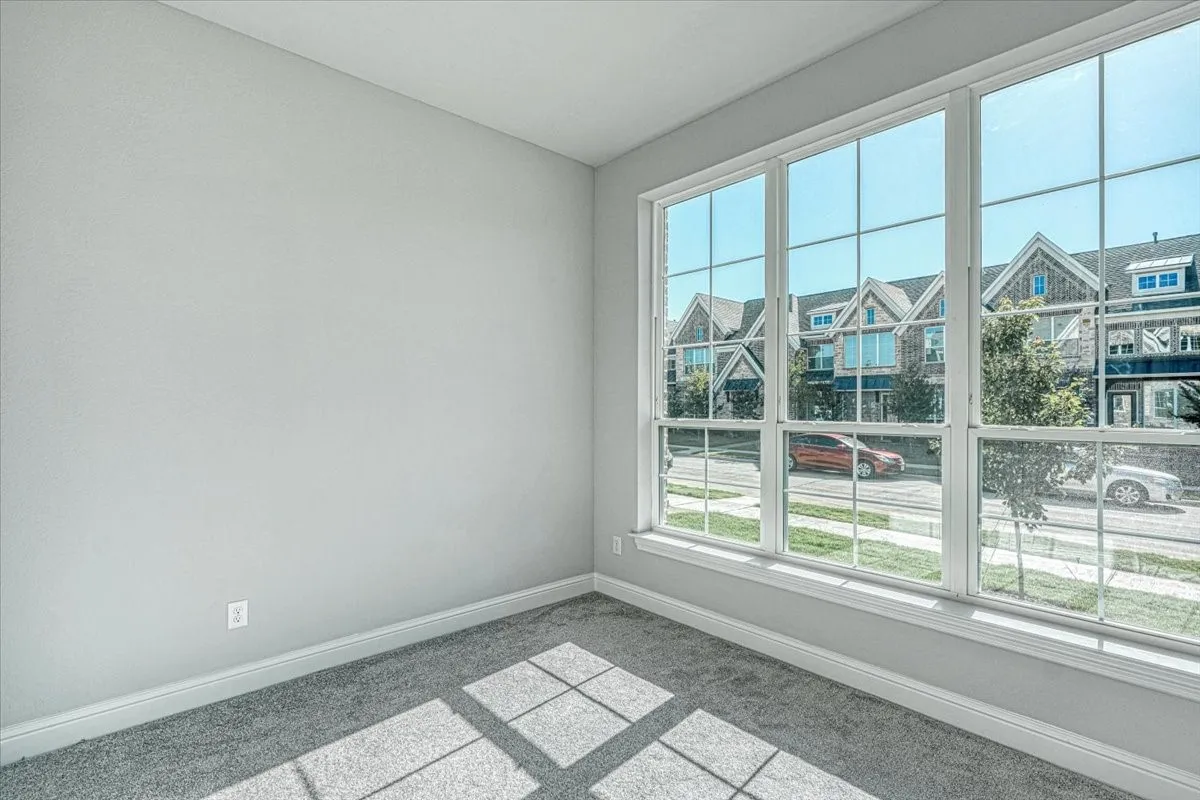 Empty room featuring carpet flooring