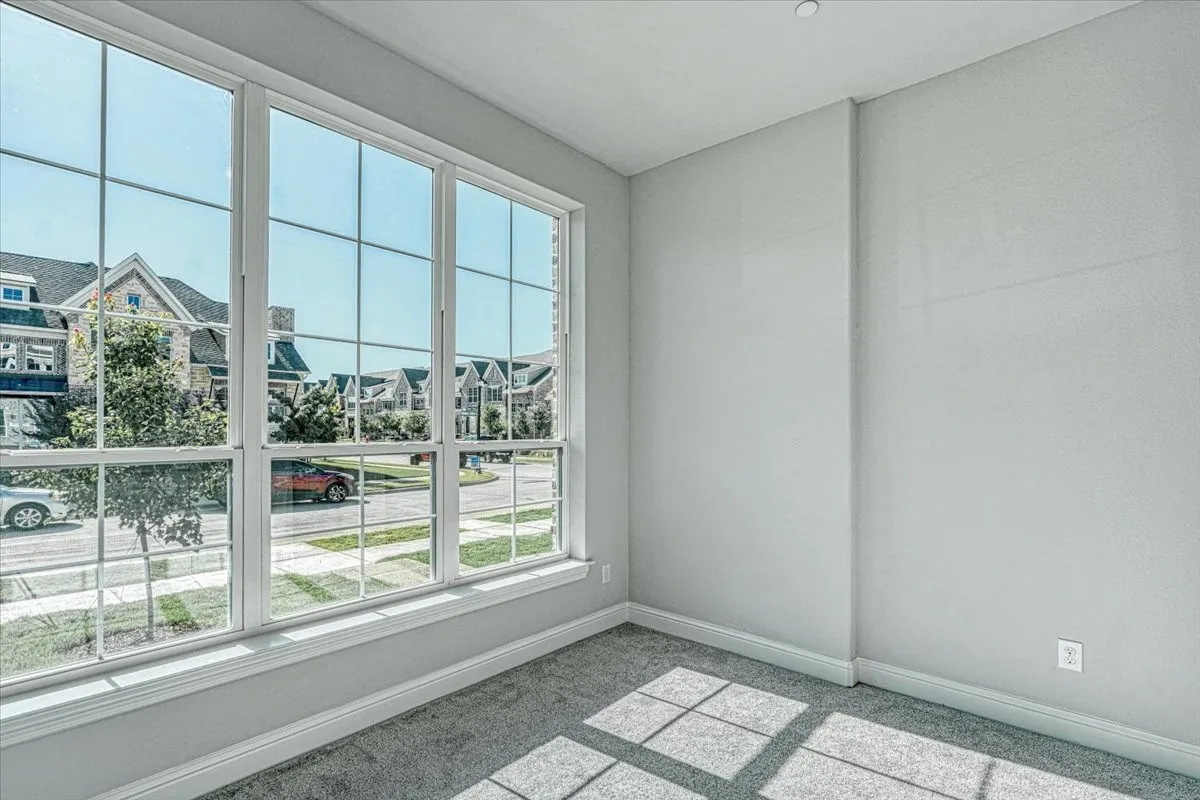 Empty room featuring carpet floors
