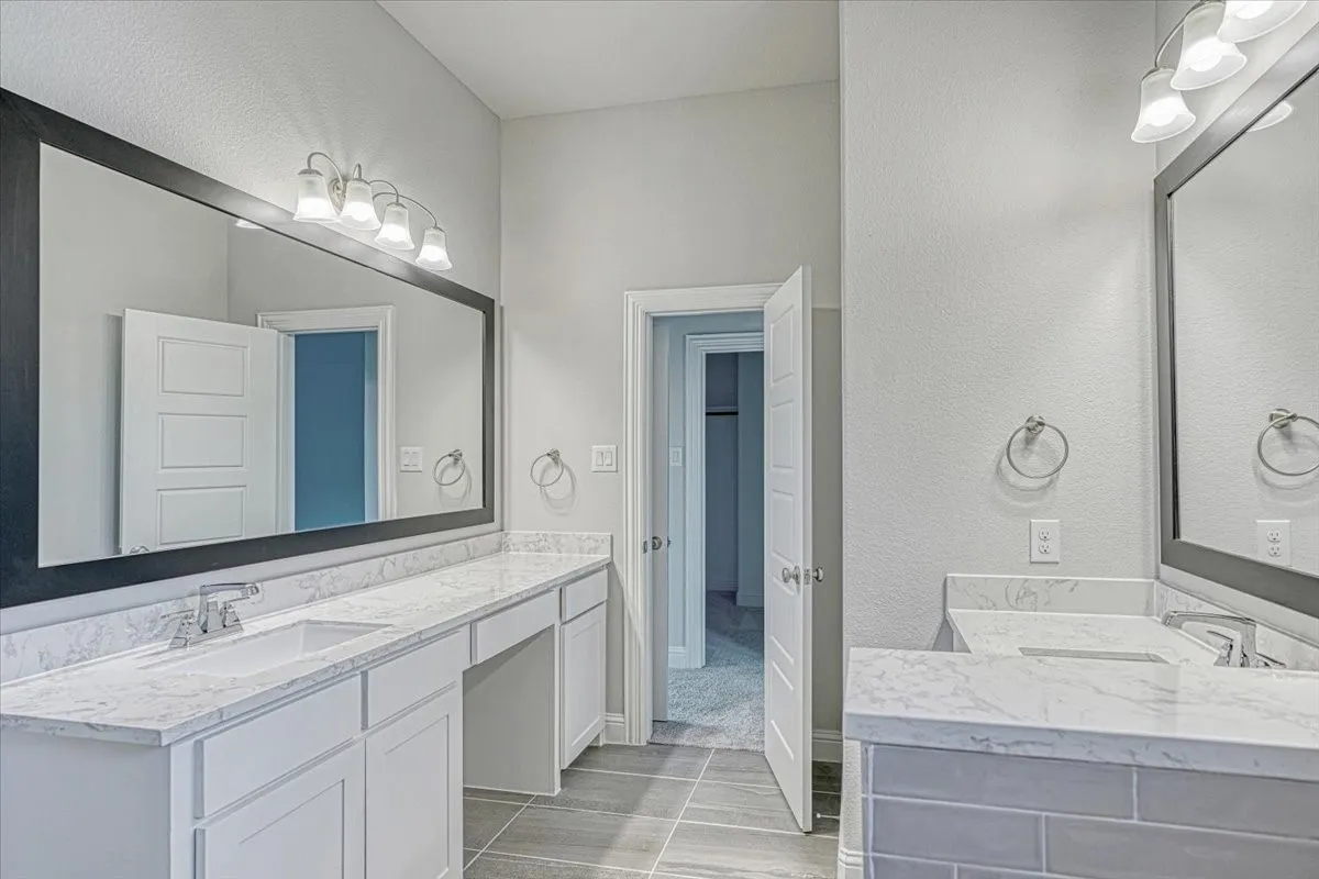 Bathroom with tile flooring and vanity